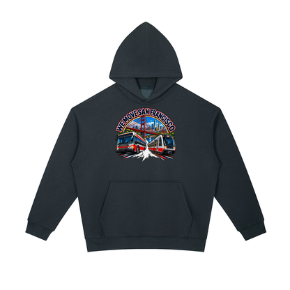 We Move San Francisco Pullover Hoodie — navy heavyweight brushed fleece with the SF transit badge printed on left chest and full back, featuring the SF skyline, cable car, Muni train, and bus.